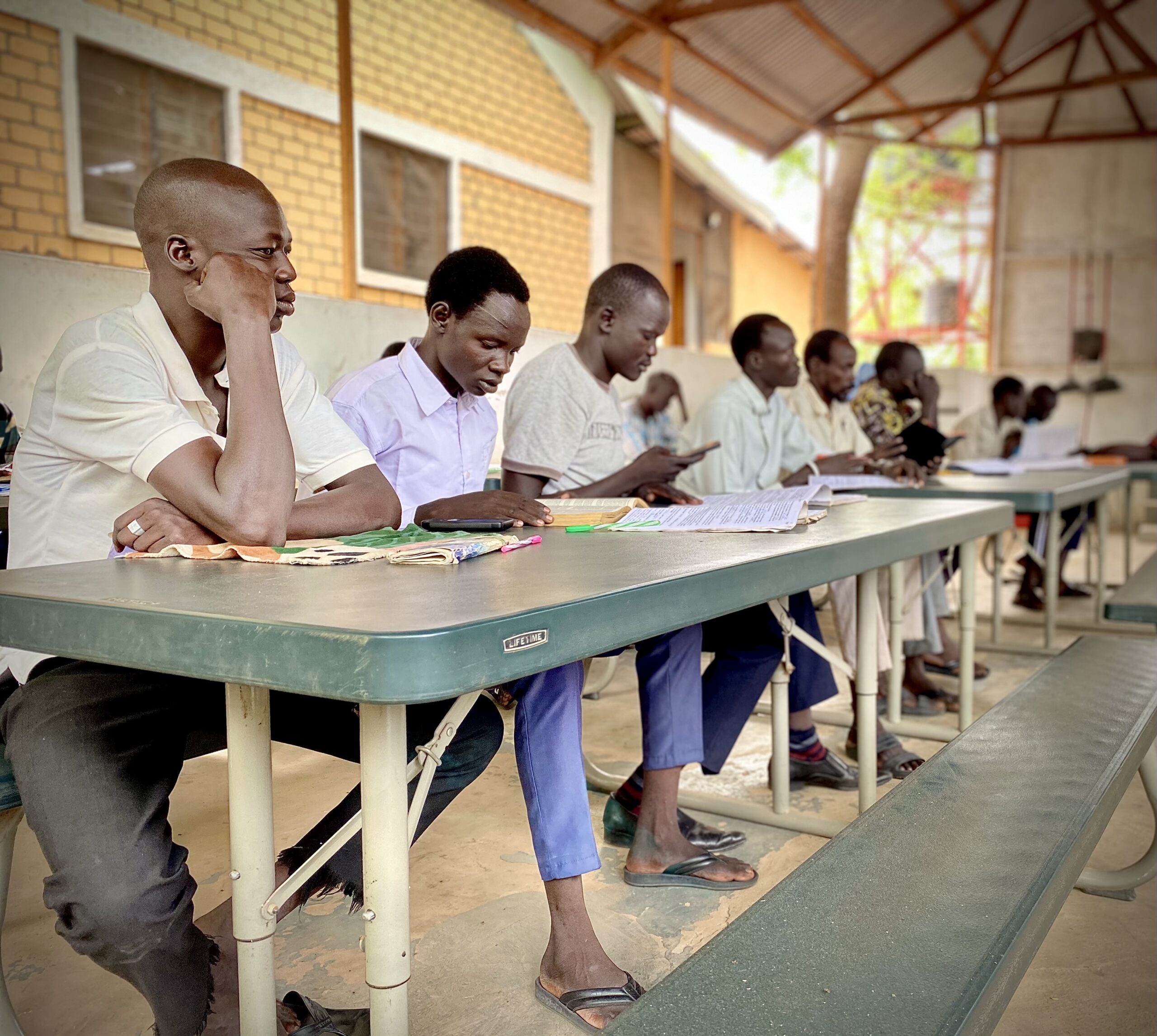 Group of people studying a bible