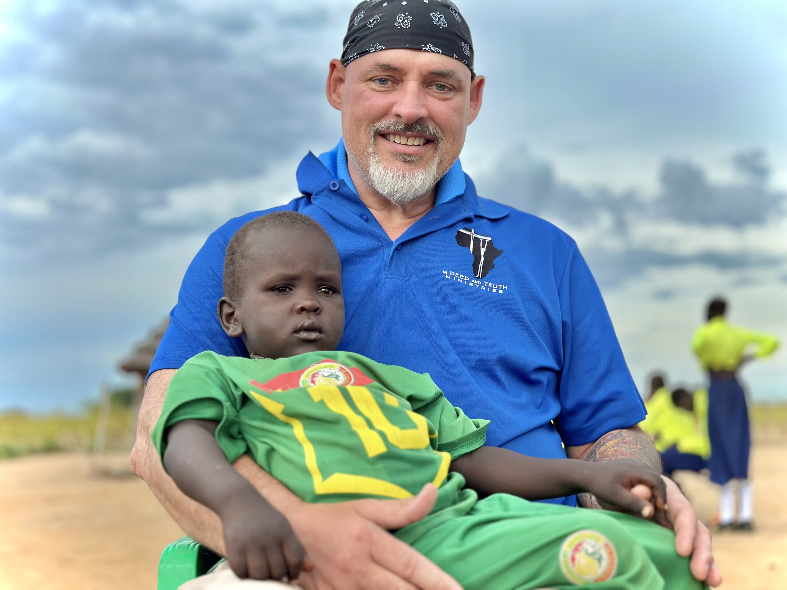 A man with holding a child