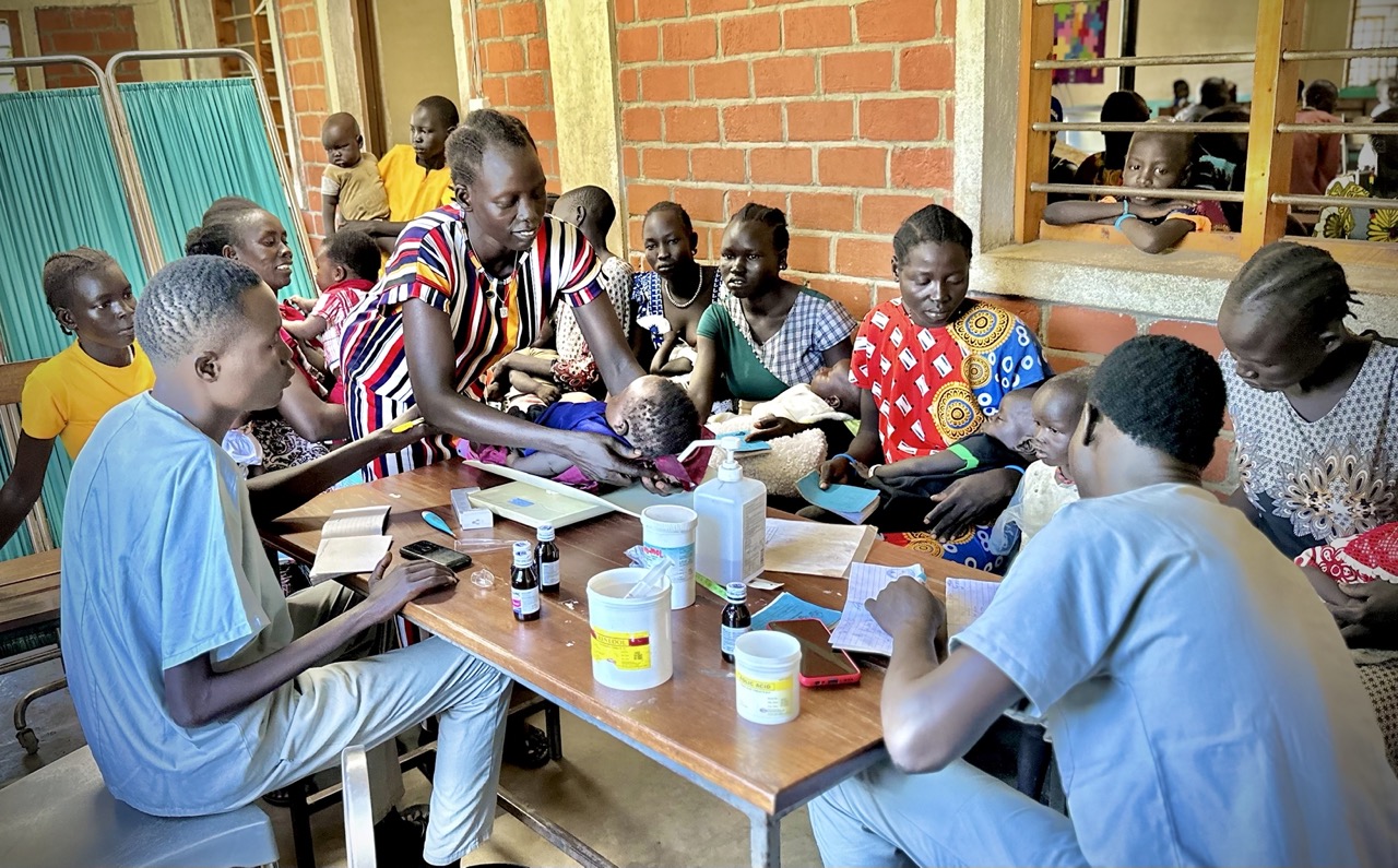 Group of people treating a kid for a better health