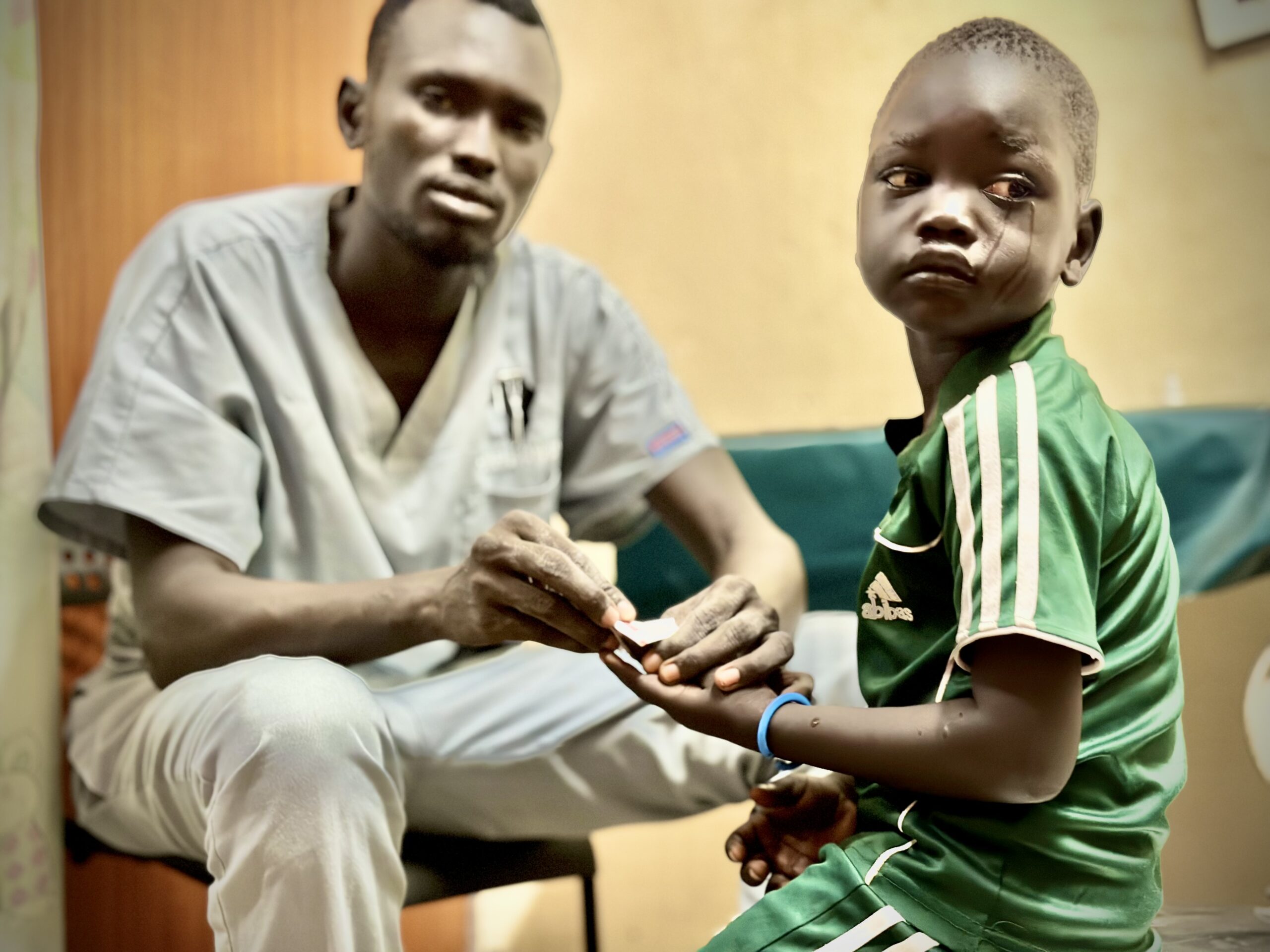 A kid getting medical treated with tears