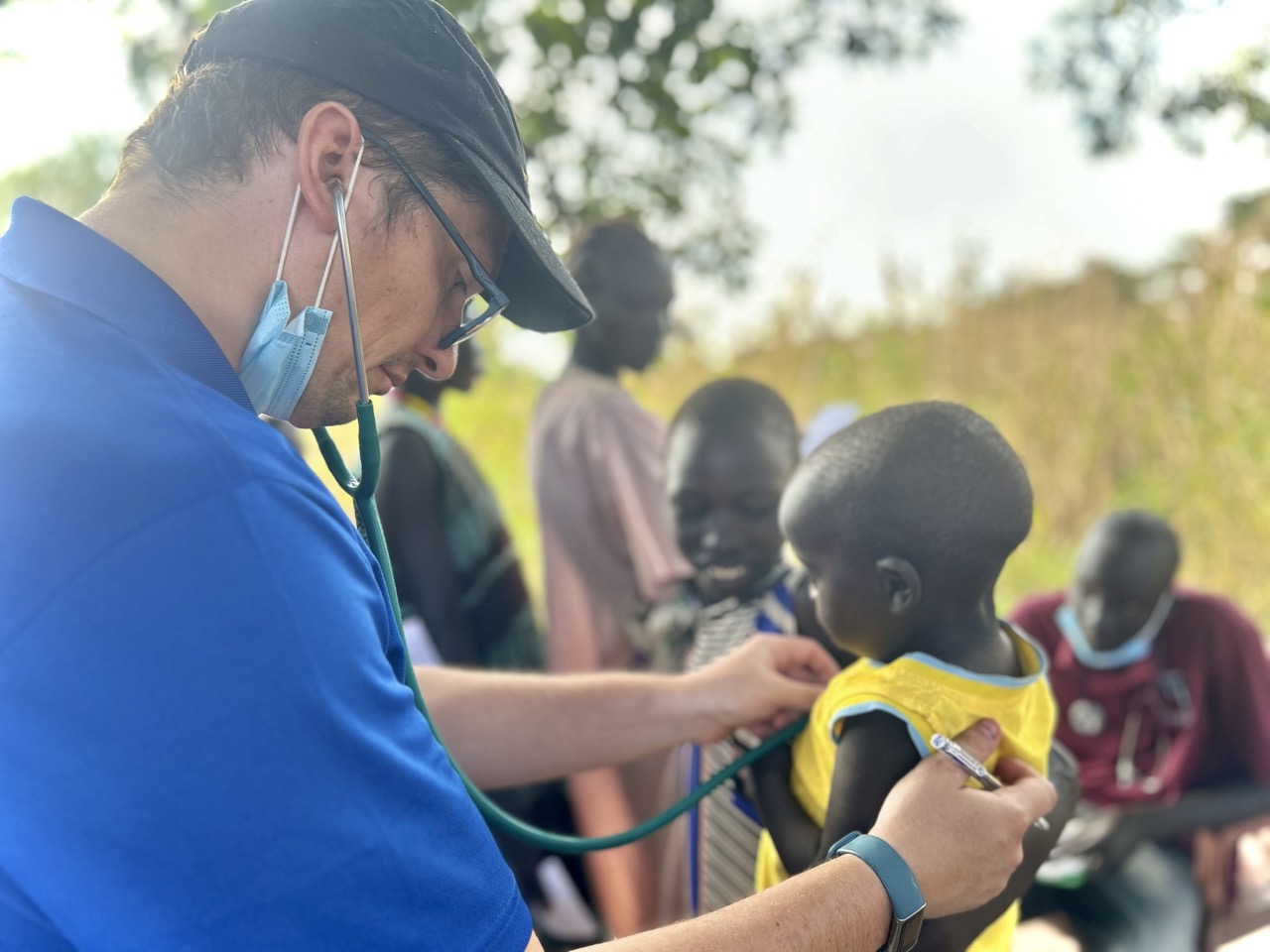 A child getting health examination from a medical staff.