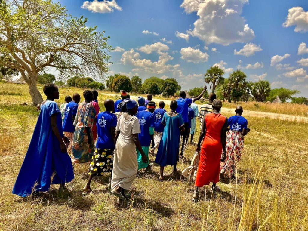 A group of people in blue shirts